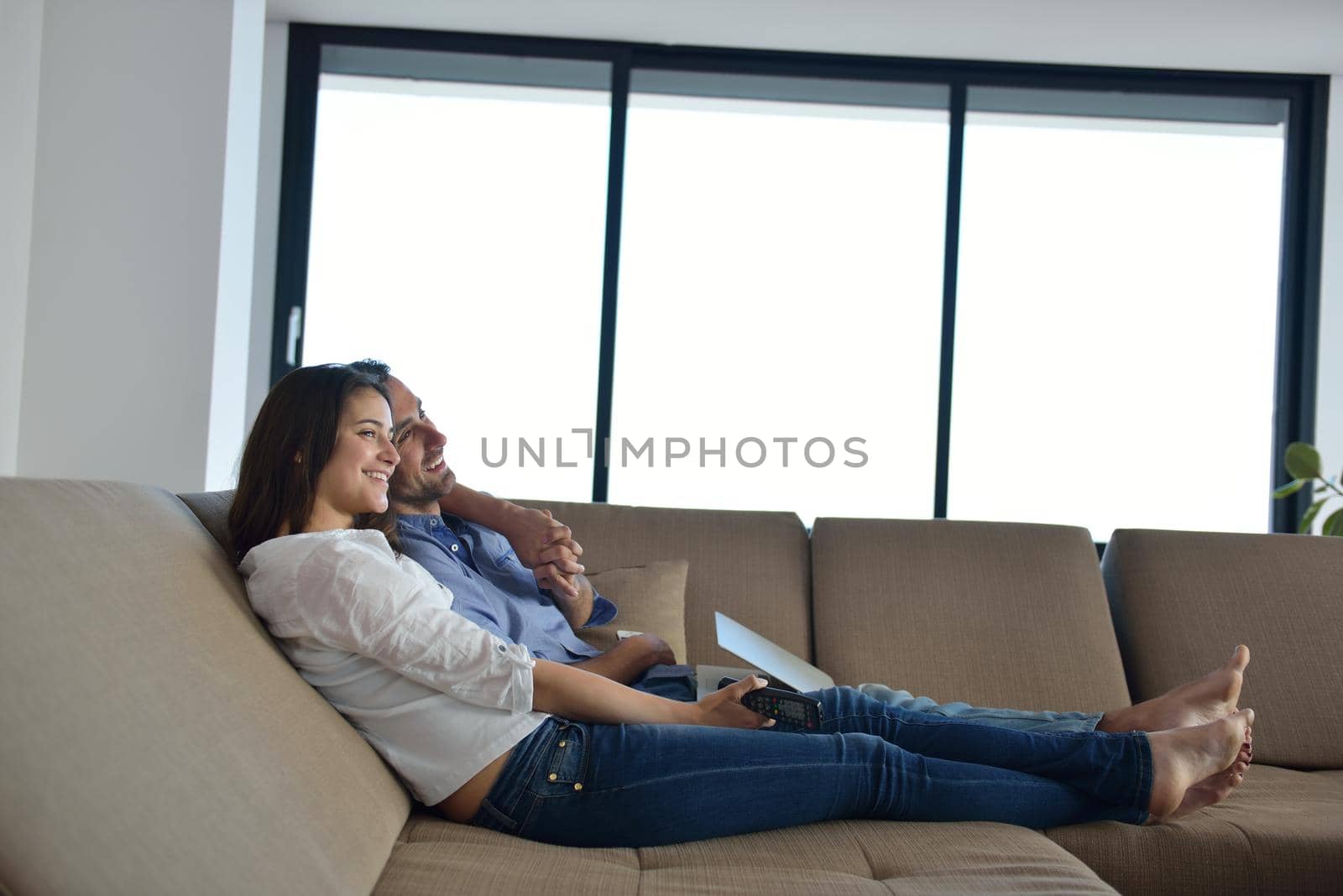 Couple on sofa by dotshock