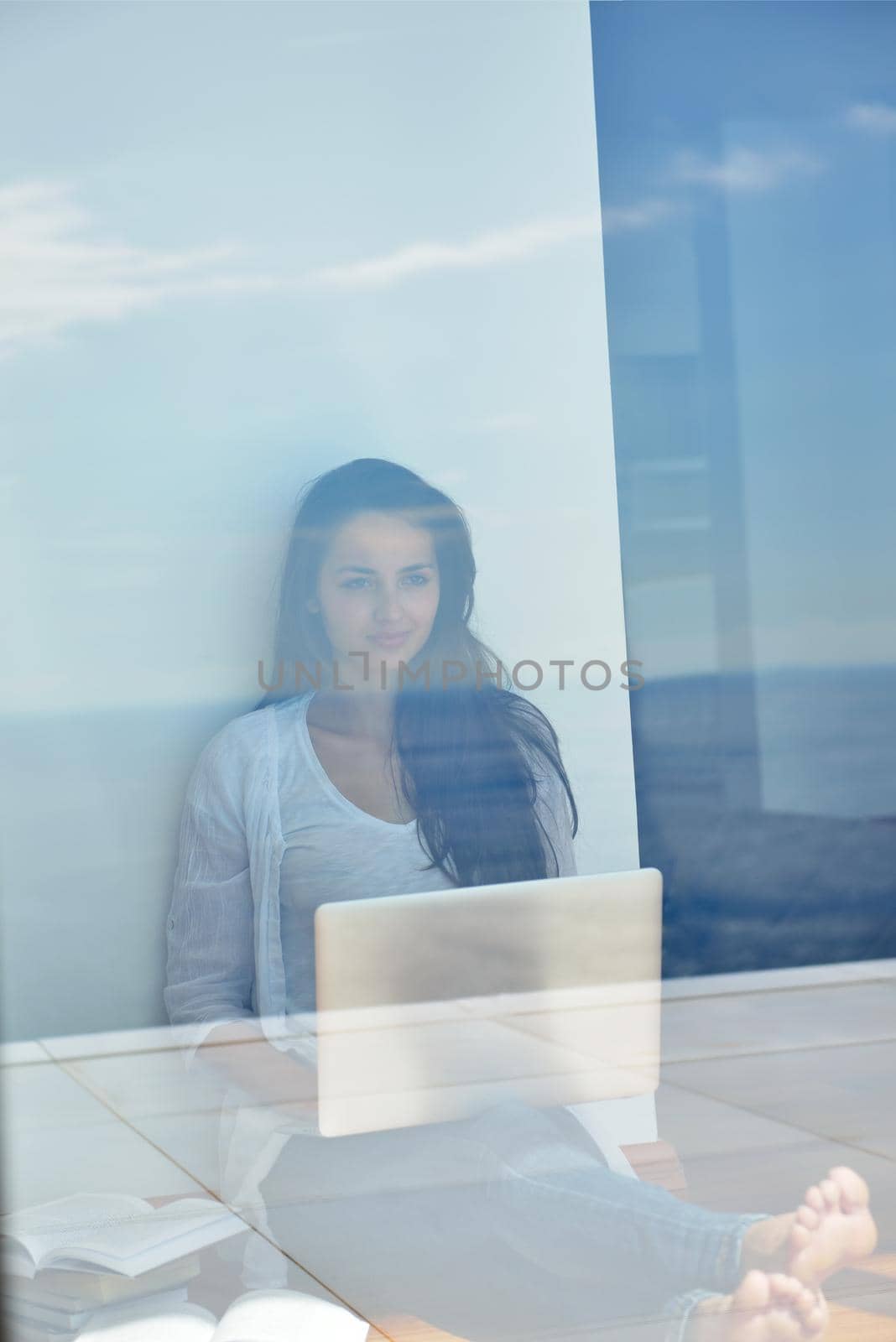 beautiful young woman relax and work on laptop computer modern  home office