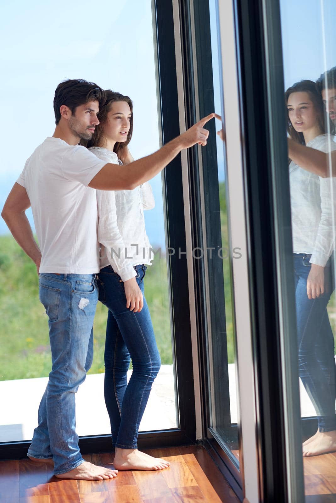 romantic happy young couple relax at modern home staircase indoors