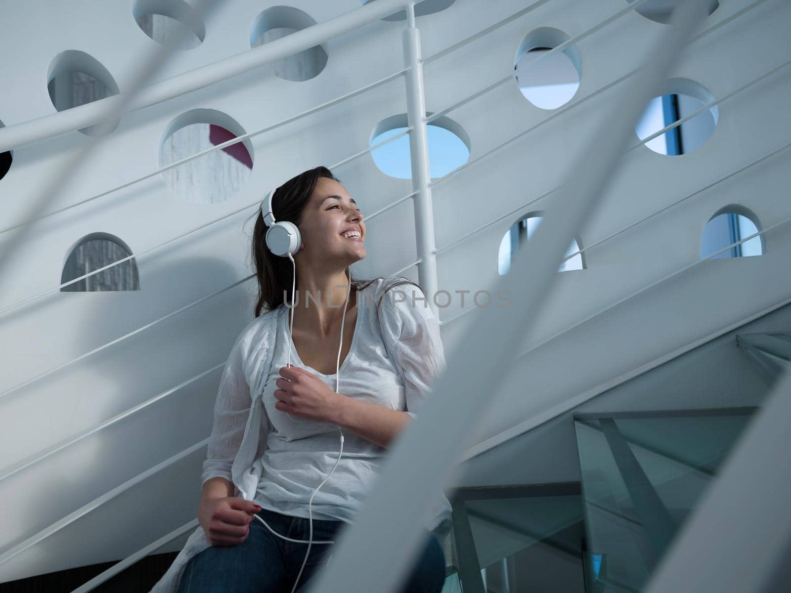 beautiful young woman relax and work on laptop computer while working on laptop computer and read book at home