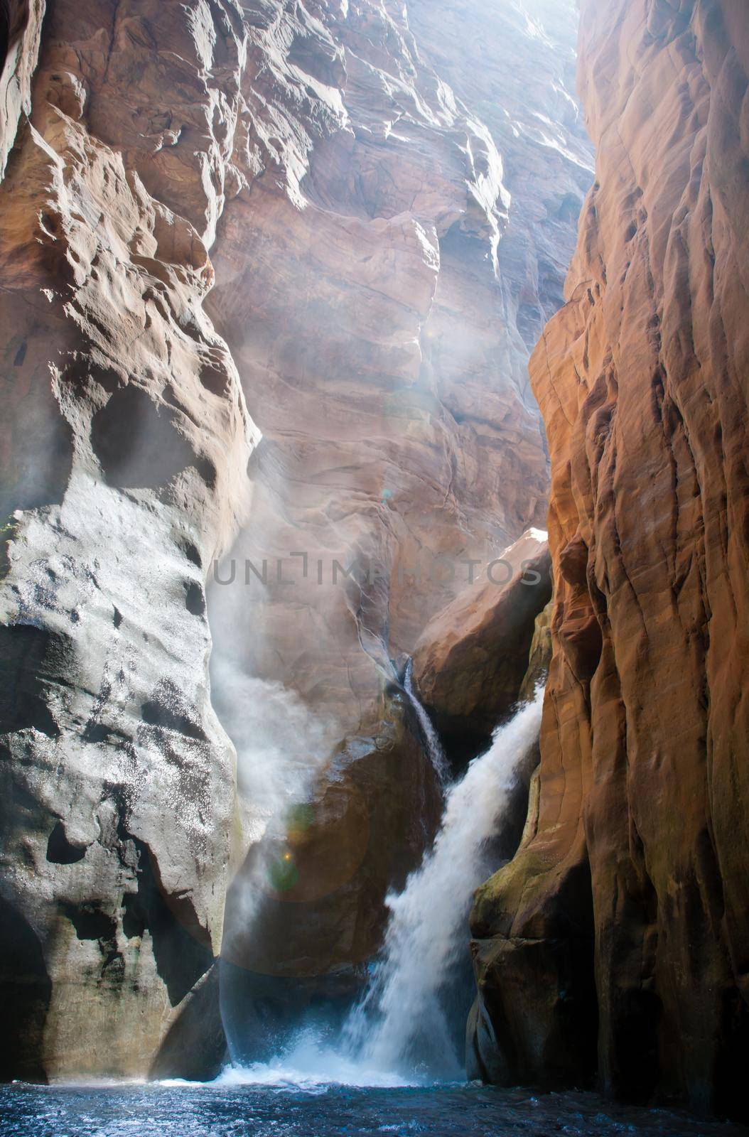 Beautiful waterfall in colorful canyon of wadi mujib, Jordan