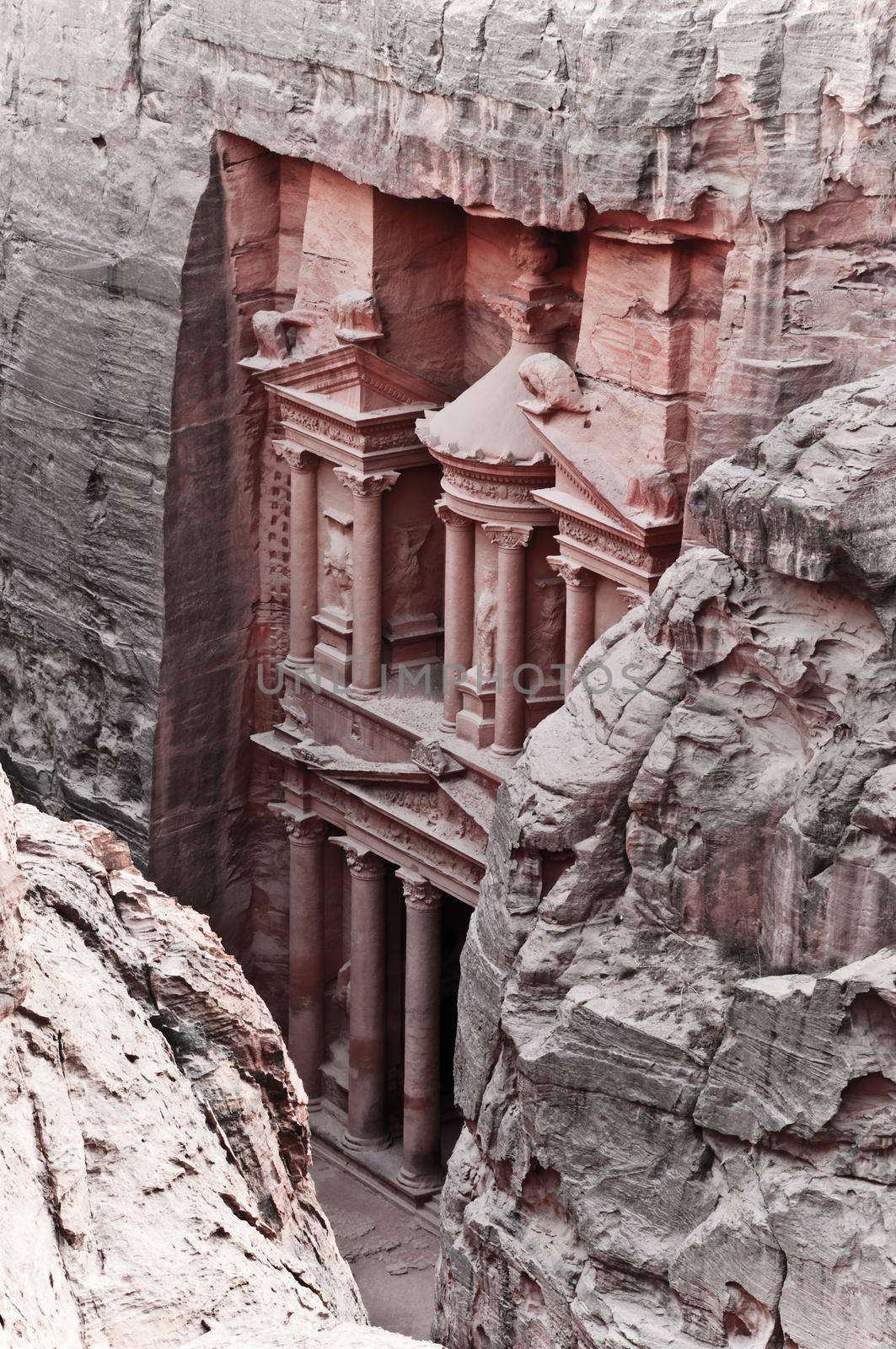 View of the red rose city of Petra from mountain, Treasury facade.