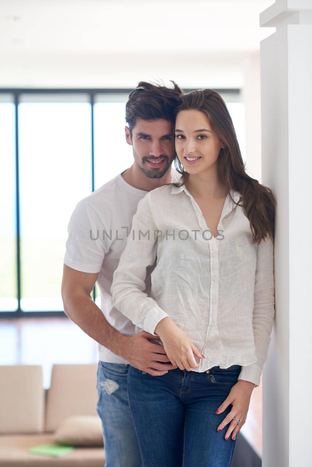 happy young romantic couple have fun relax smile at modern home outdoor terace balcony terace