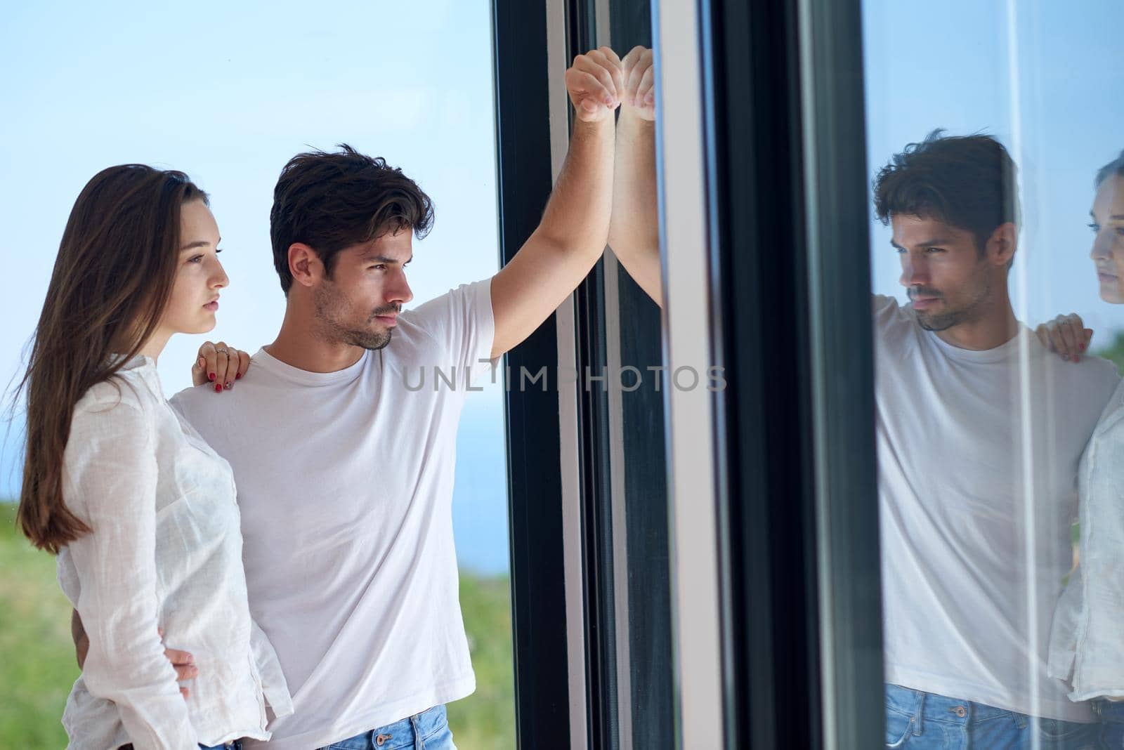 romantic happy young couple relax at modern home staircase indoors