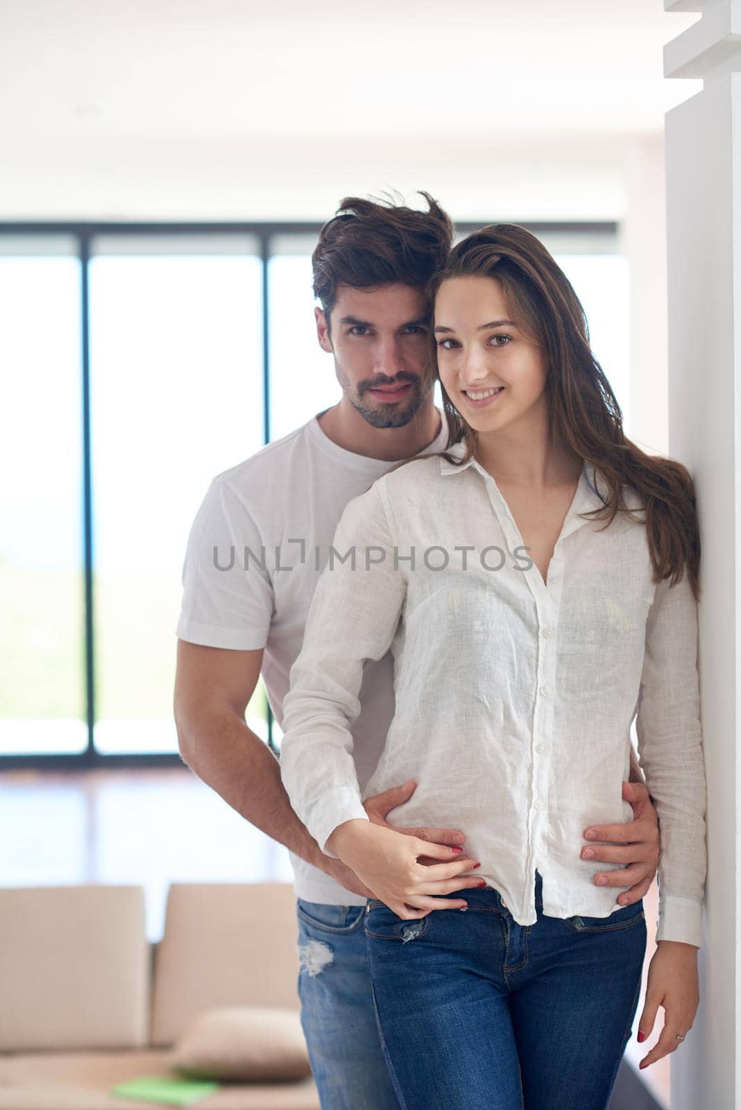 happy young romantic couple have fun relax smile at modern home outdoor terace balcony terace