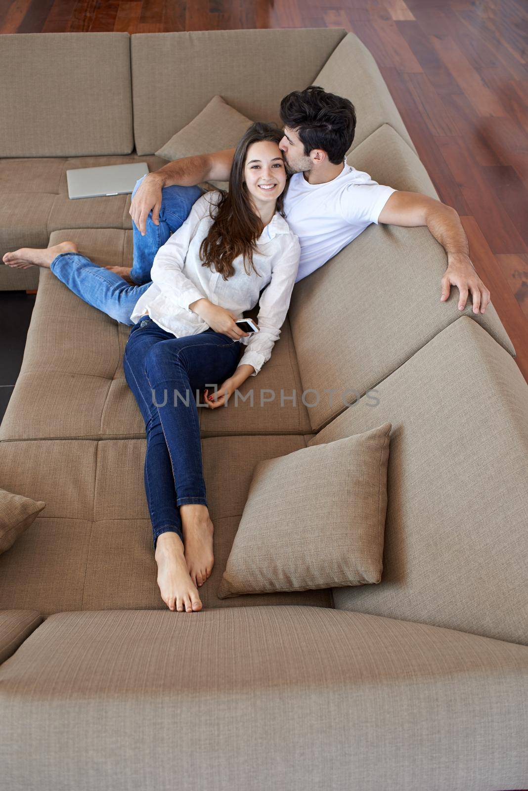 happy young romantic couple have fun and  relax at home indoors by dotshock