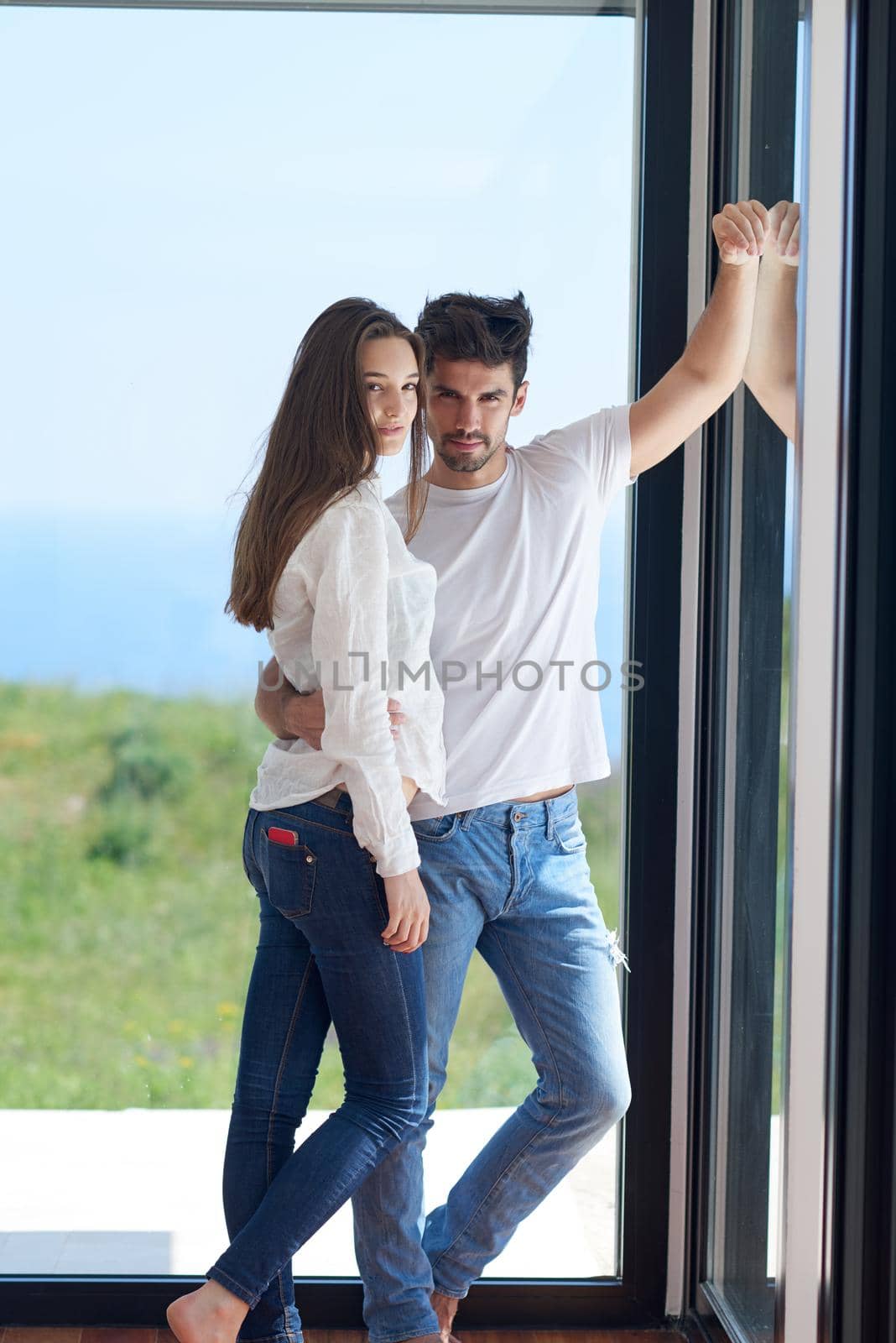 romantic happy young couple relax at modern home staircase indoors