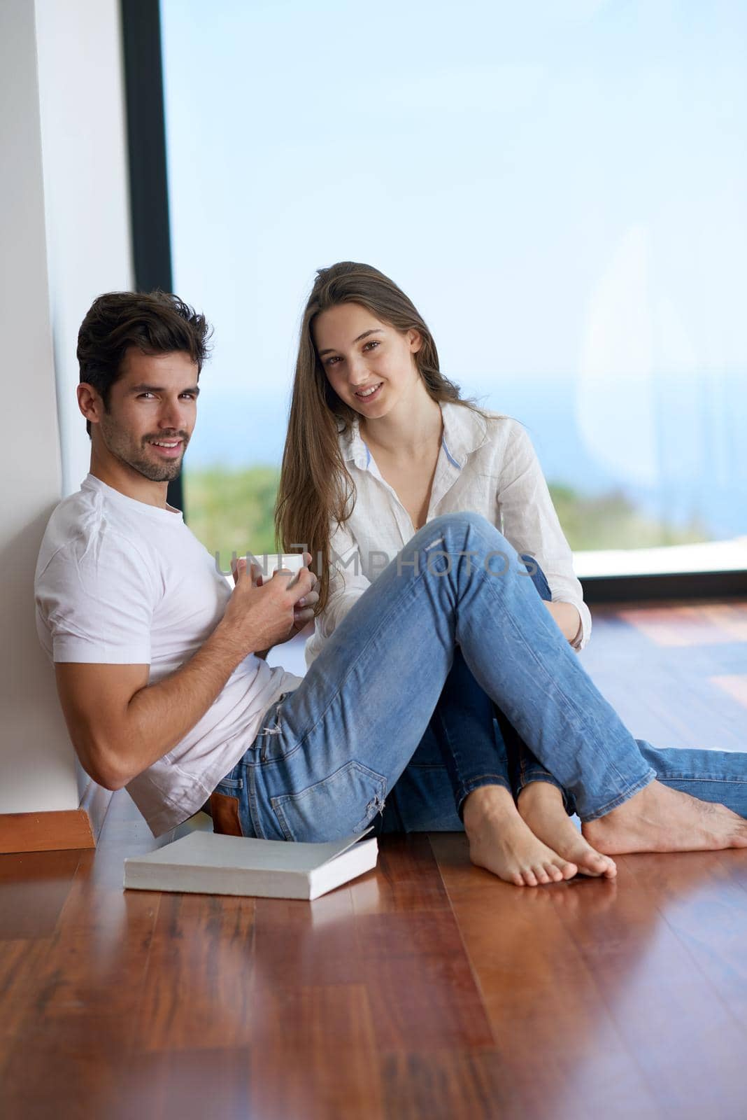 romantic happy young couple relax at modern home staircase indoors