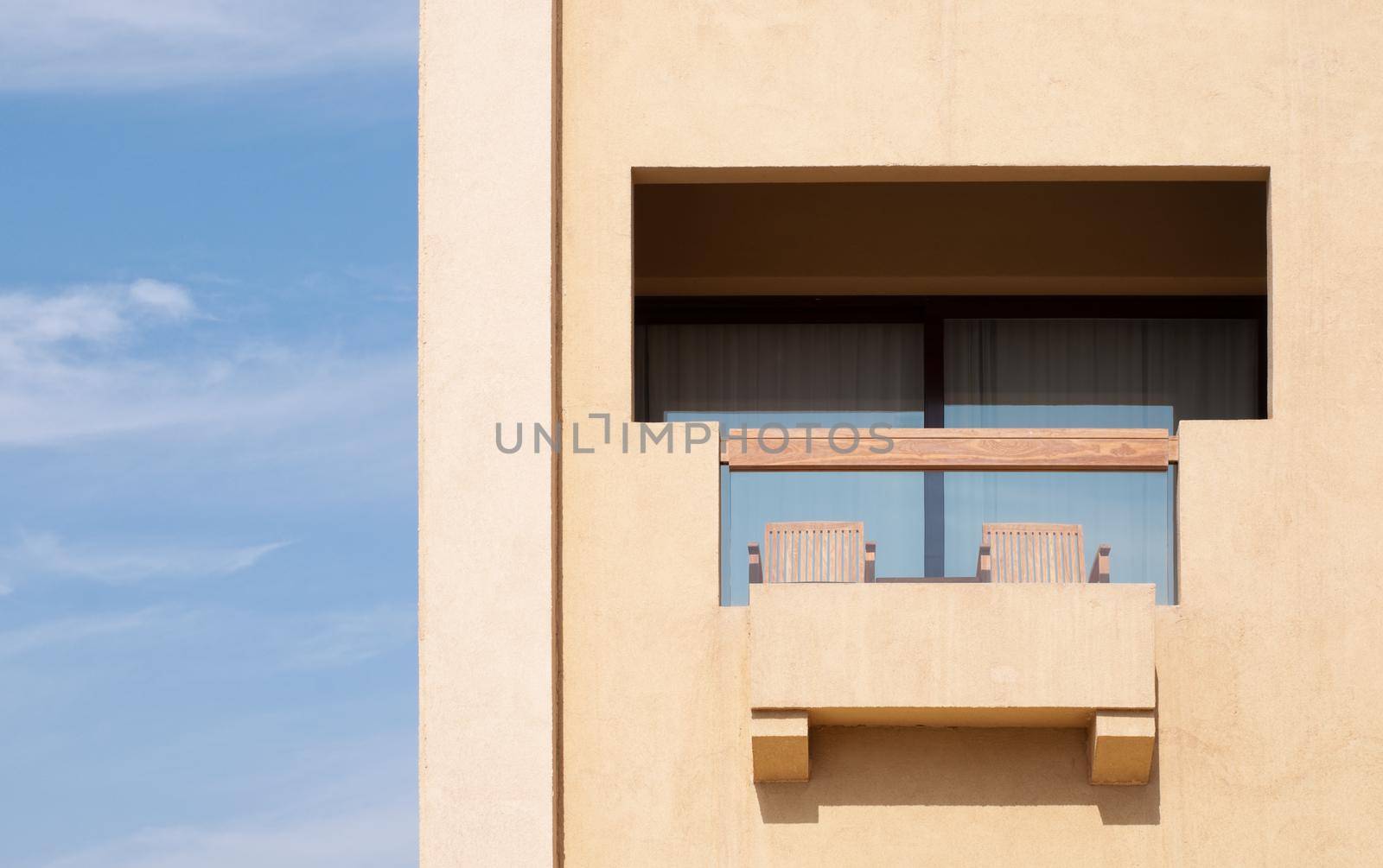 modern hotel balcony with blues sky in background