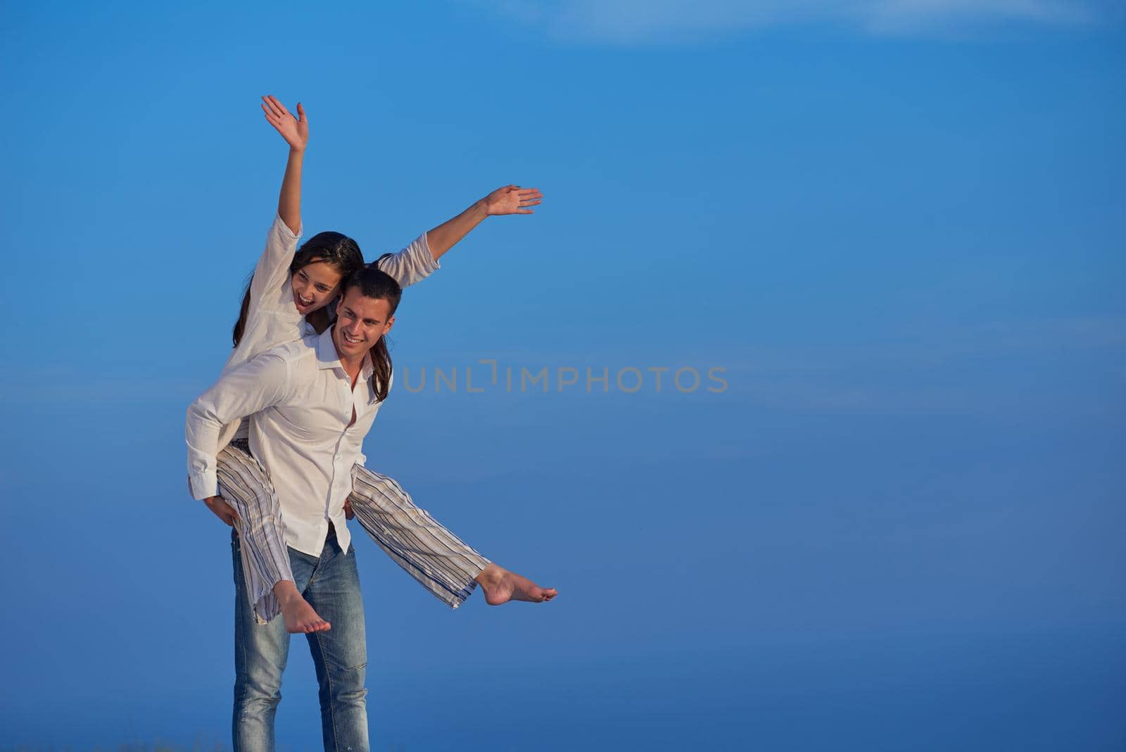 happy young romantic couple have fun arelax  relax at home by dotshock