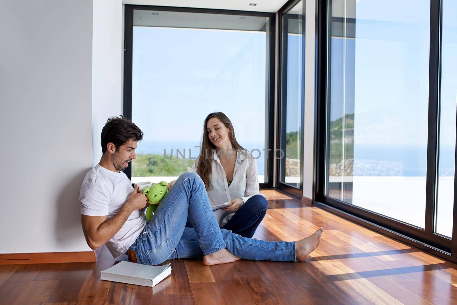 romantic happy young couple relax at modern home staircase indoors