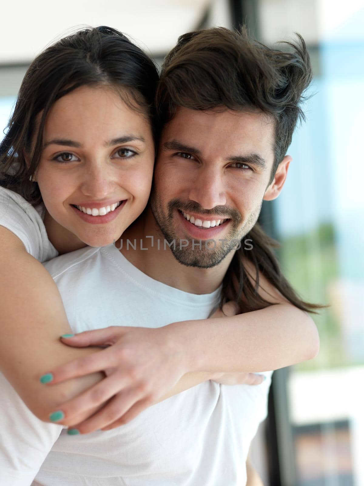 romantic happy young couple relax at modern home indoors and have fun