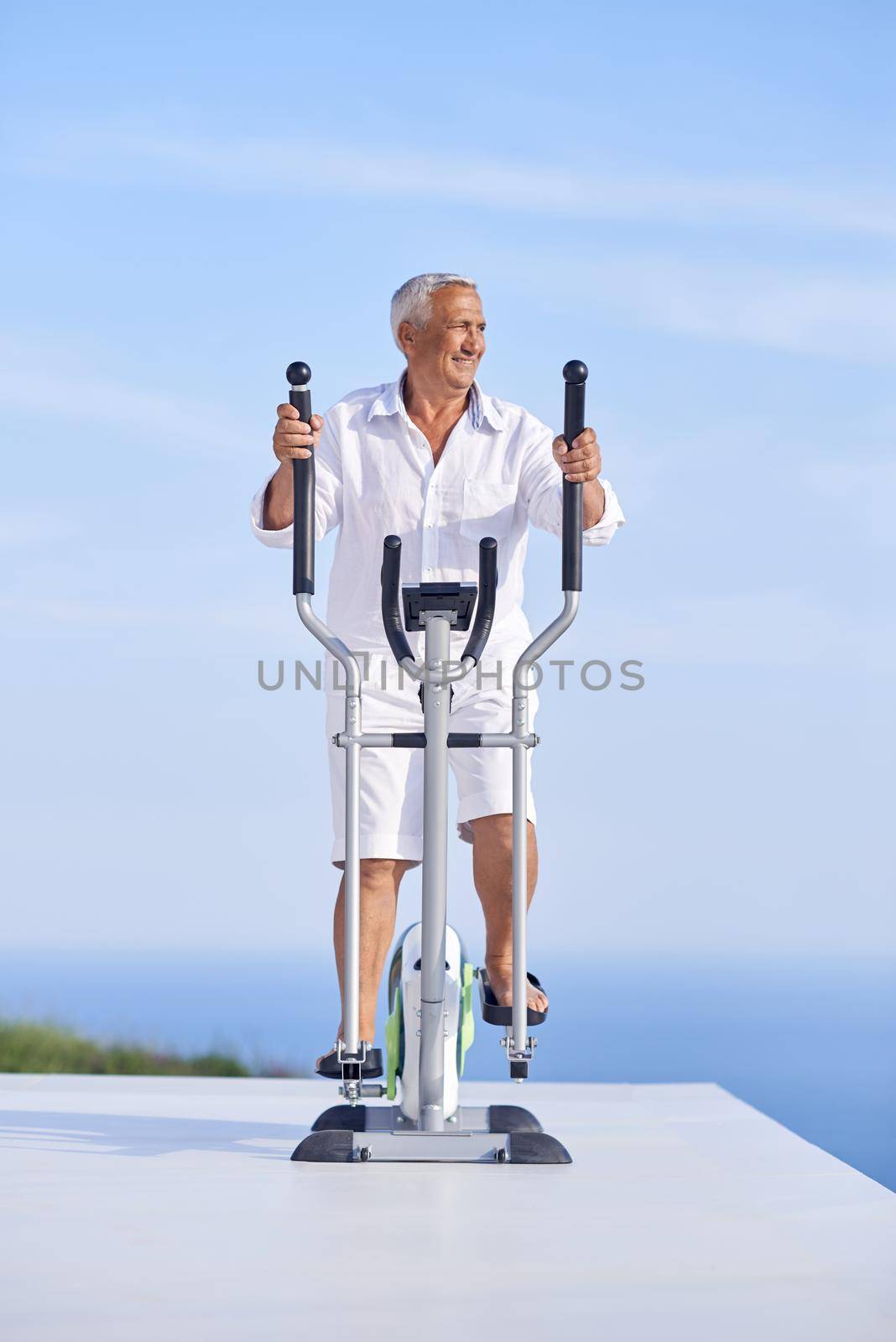 healthy senior man working out by dotshock