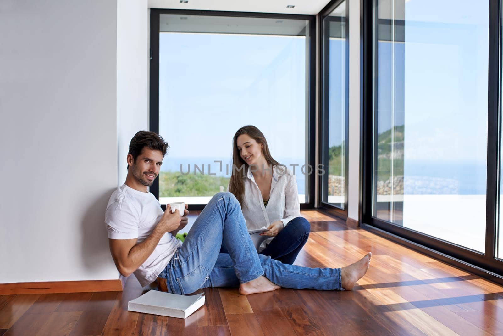 romantic happy young couple relax at modern home staircase indoors