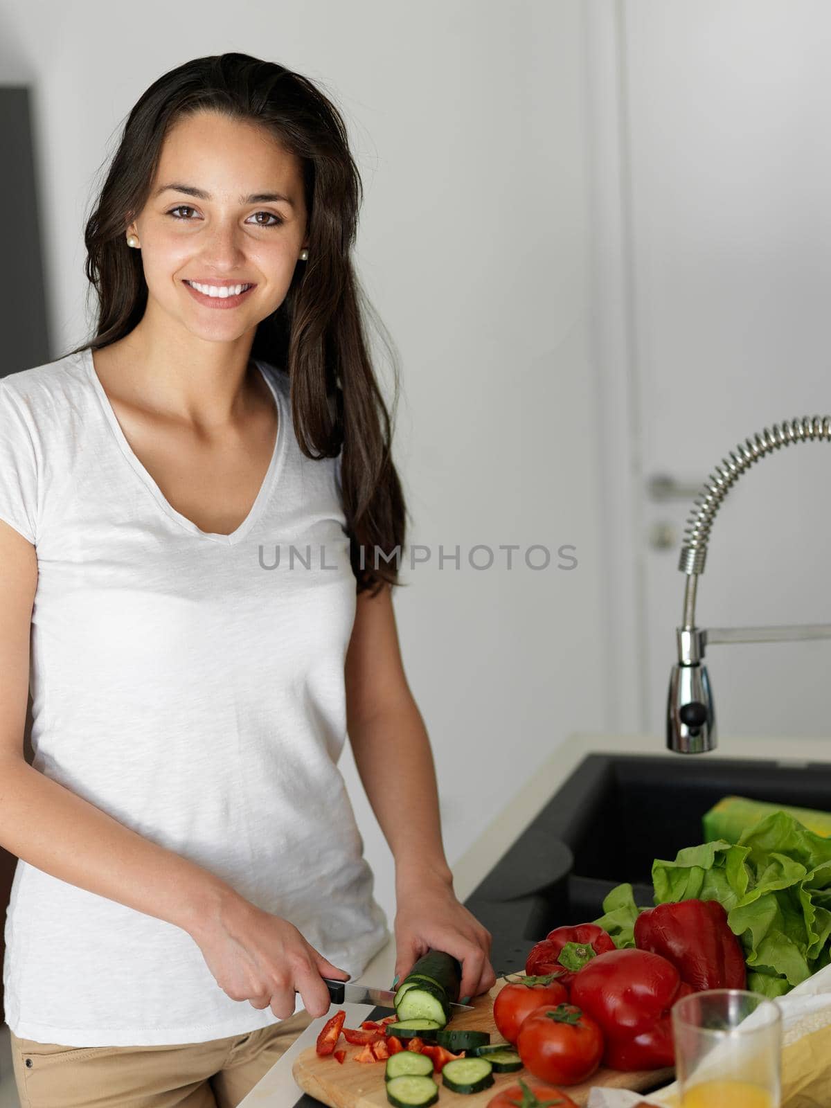 Young Woman Cooking in the kitchen by dotshock