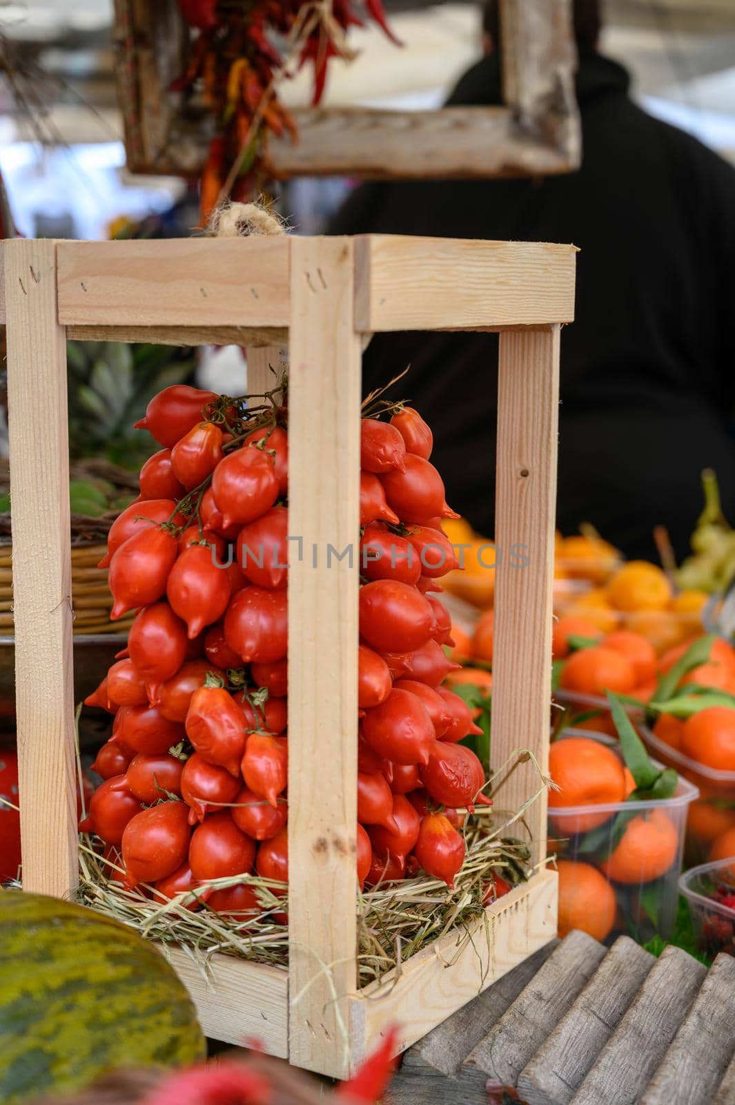 Stalls with chilli and vegetables at a weekly market in Rome.