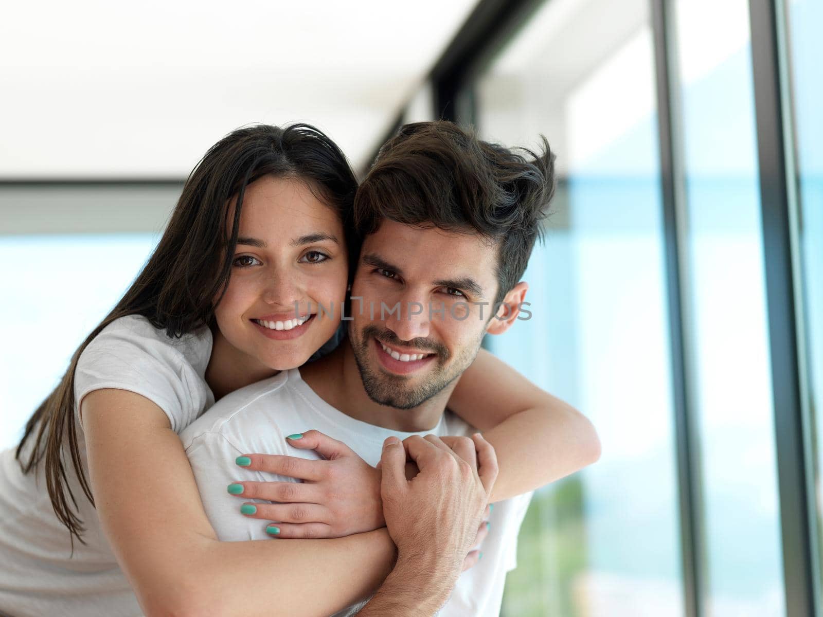 romantic happy young couple relax at modern home indoors and have fun