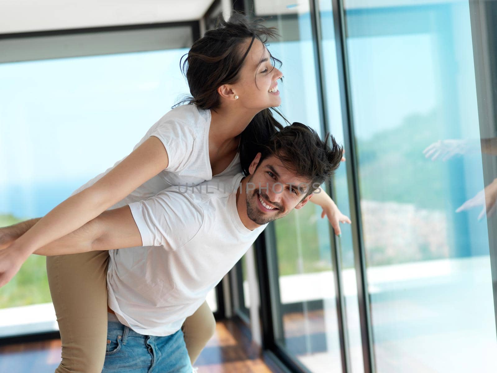 romantic happy young couple relax at modern home indoors and have fun