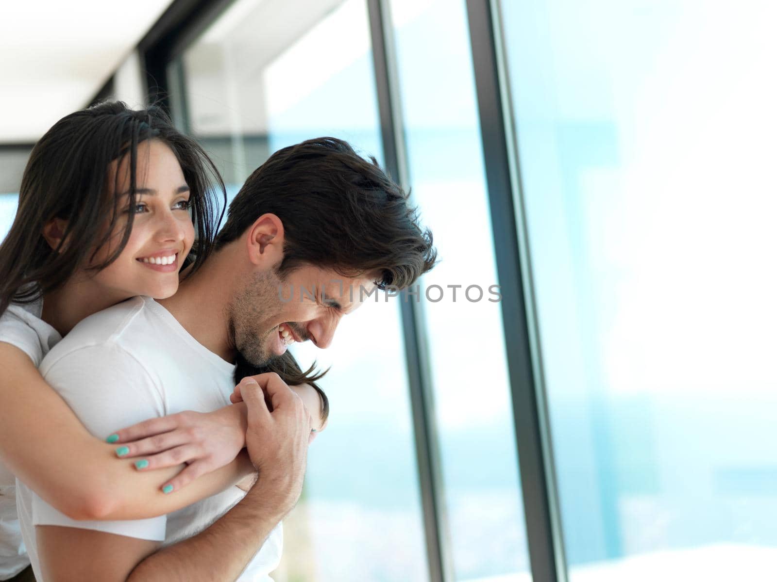 romantic happy young couple relax at modern home indoors and have fun