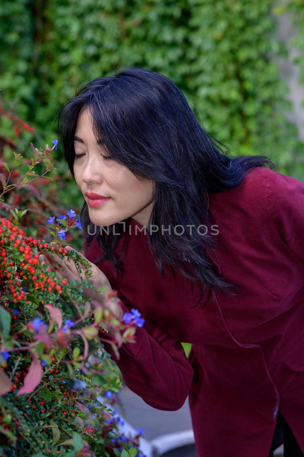 Beautiful chinese woman on a sunny autumn day in the city.