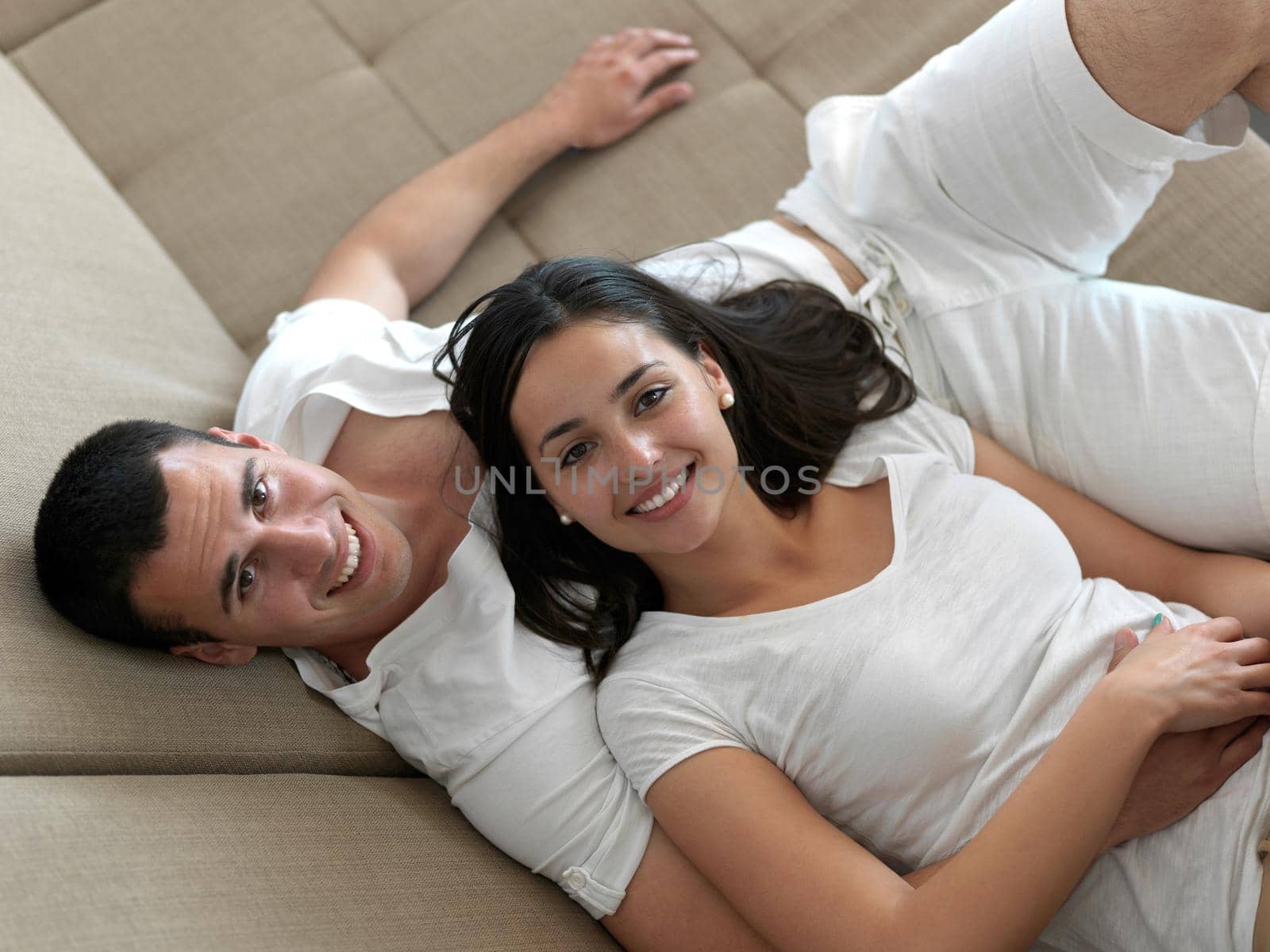 romantic happy young couple relax at modern home indoors and have fun