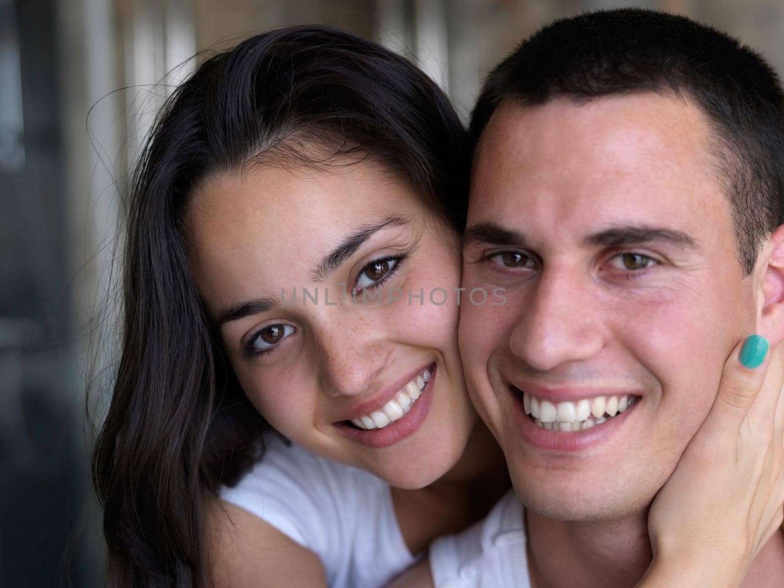 happy young couple relax and have fun in bed