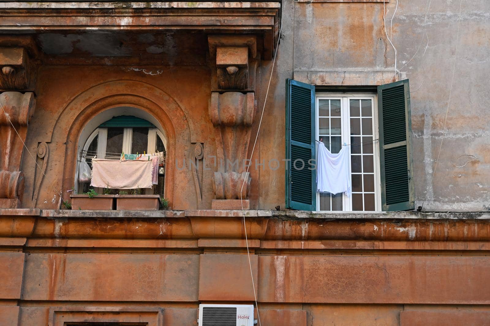 A typical old Italian house with a clothesline between the windows.