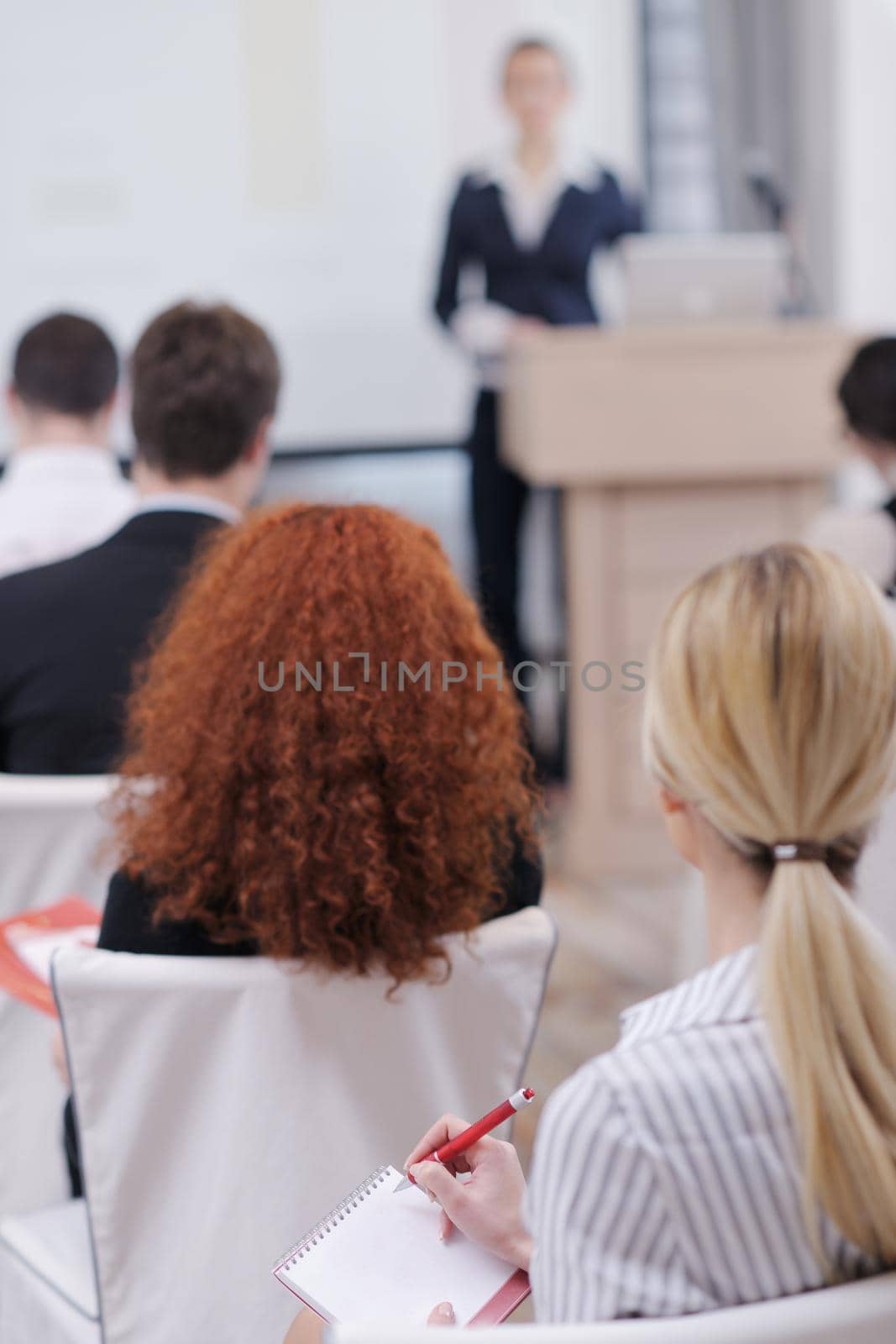 business people group at meeting seminar presentation in brigt conference room