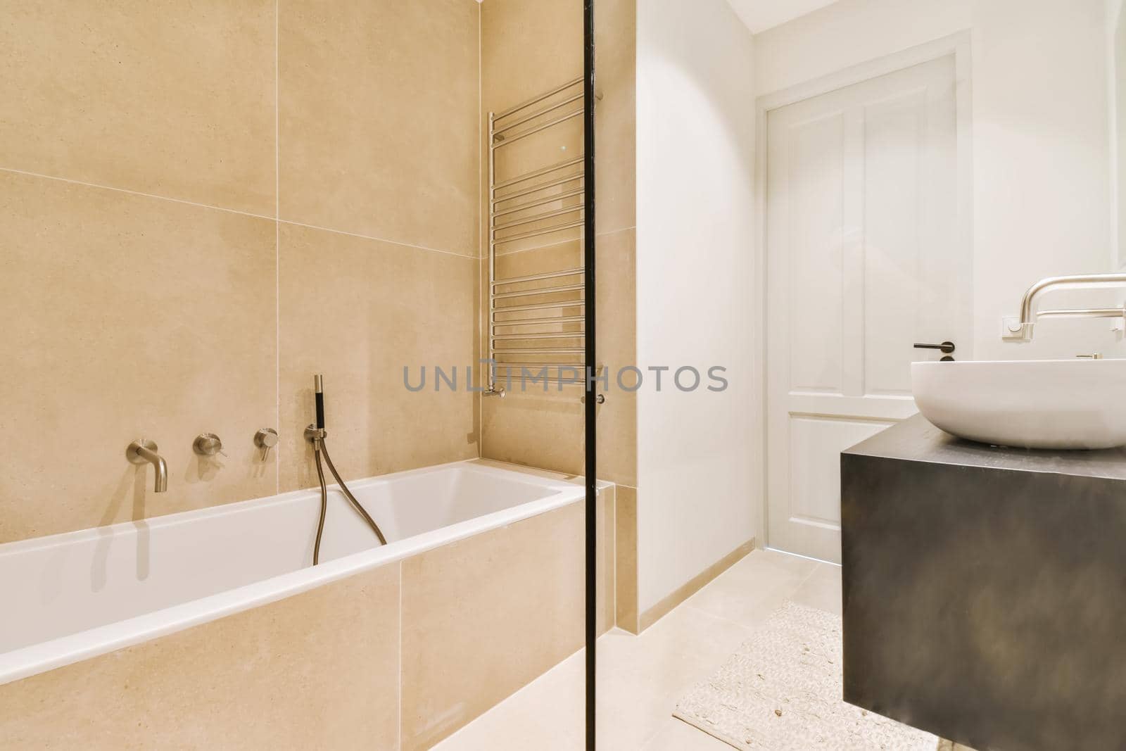 Beautiful bathroom with a big bathtub and white walls
