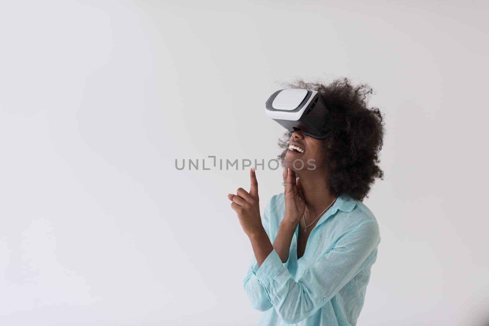 black girl using VR headset glasses of virtual reality by dotshock