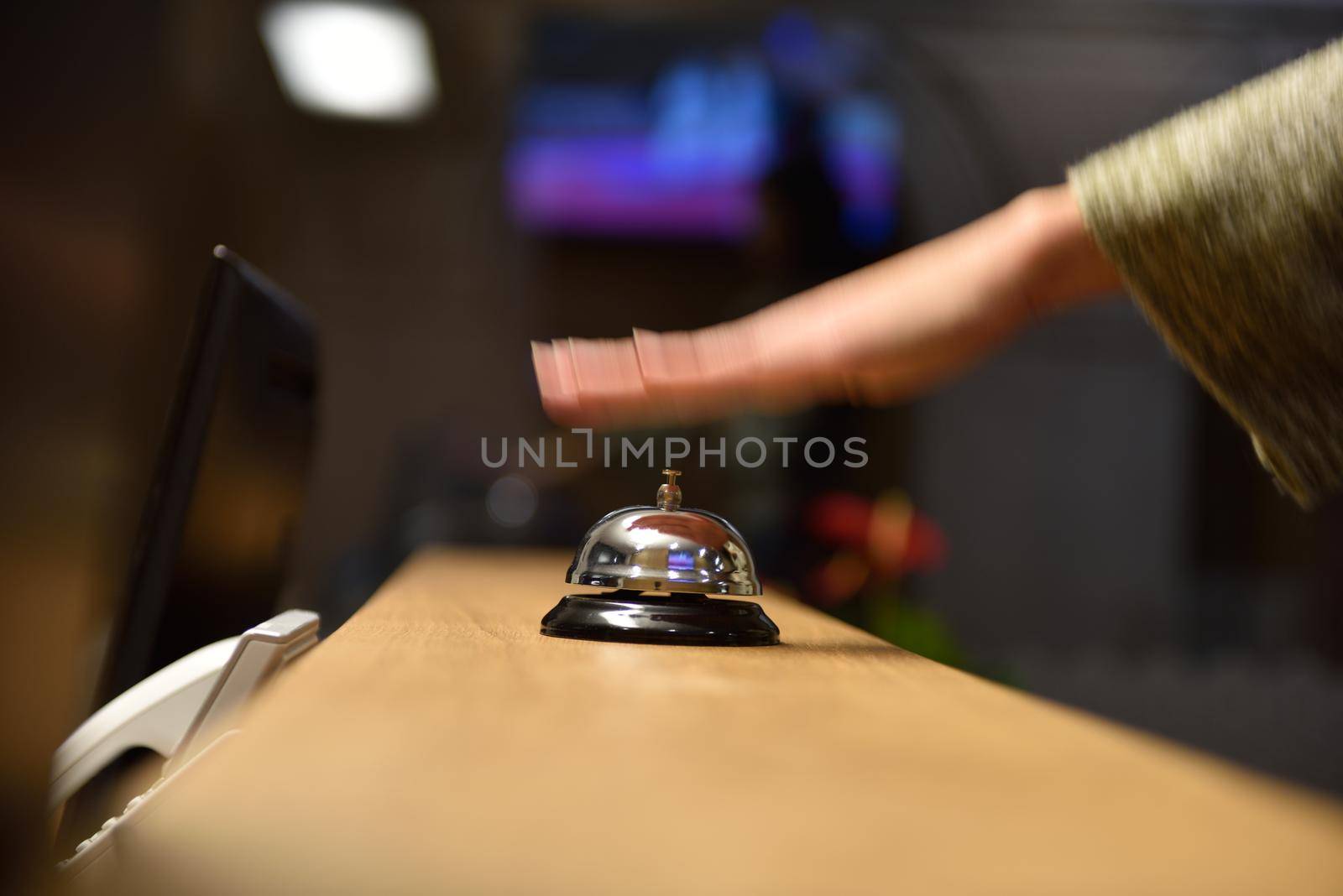 business woman at the reception of a hotel checking in