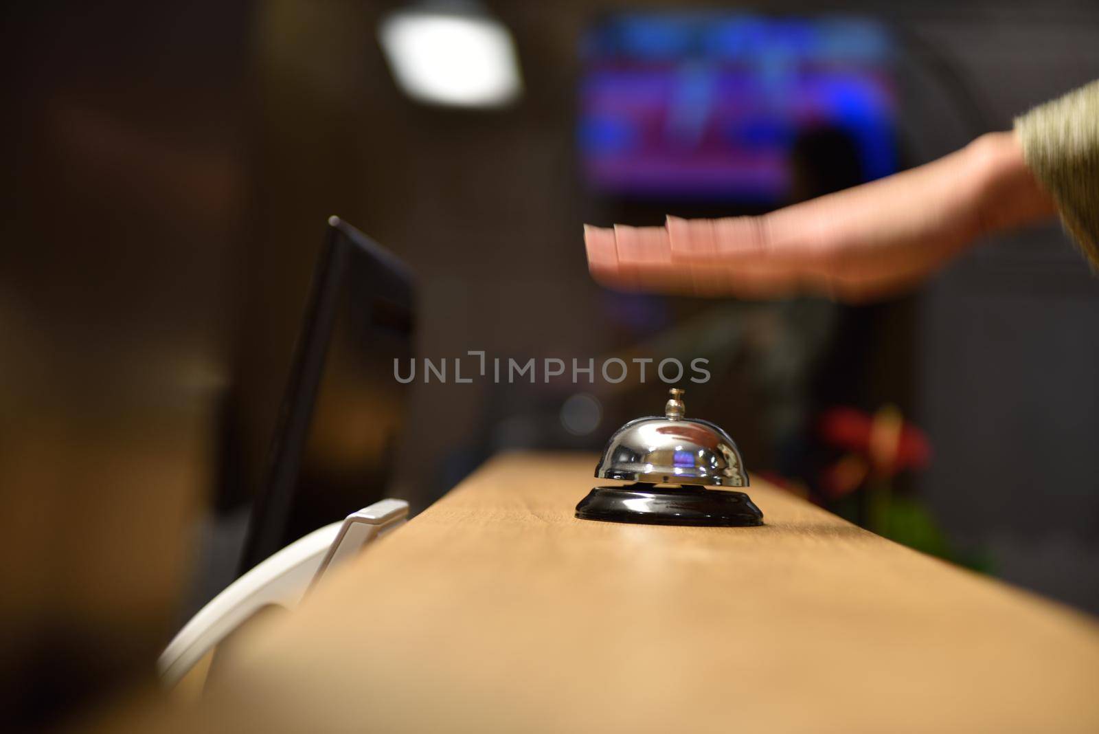 business woman at the reception of a hotel checking in