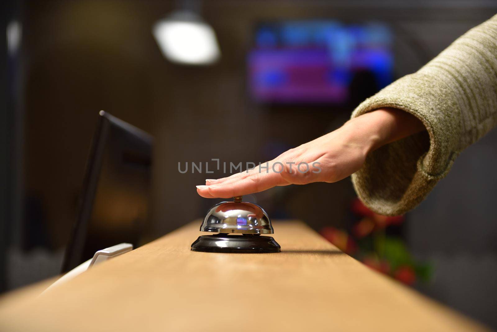 business woman at the reception of a hotel checking in