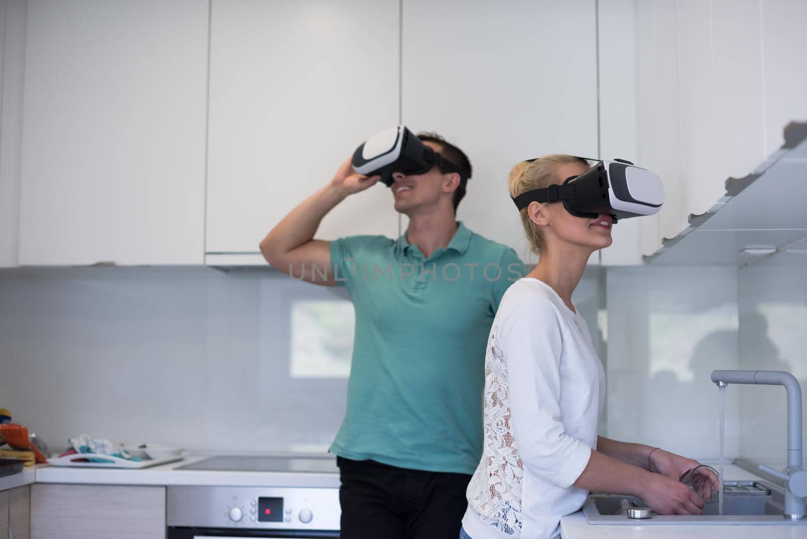 young couple using VR-headset glasses of virtual reality by dotshock