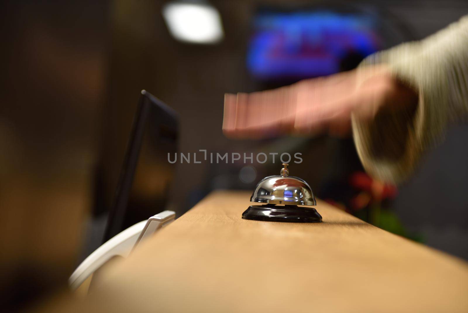 business woman at the reception of a hotel checking in