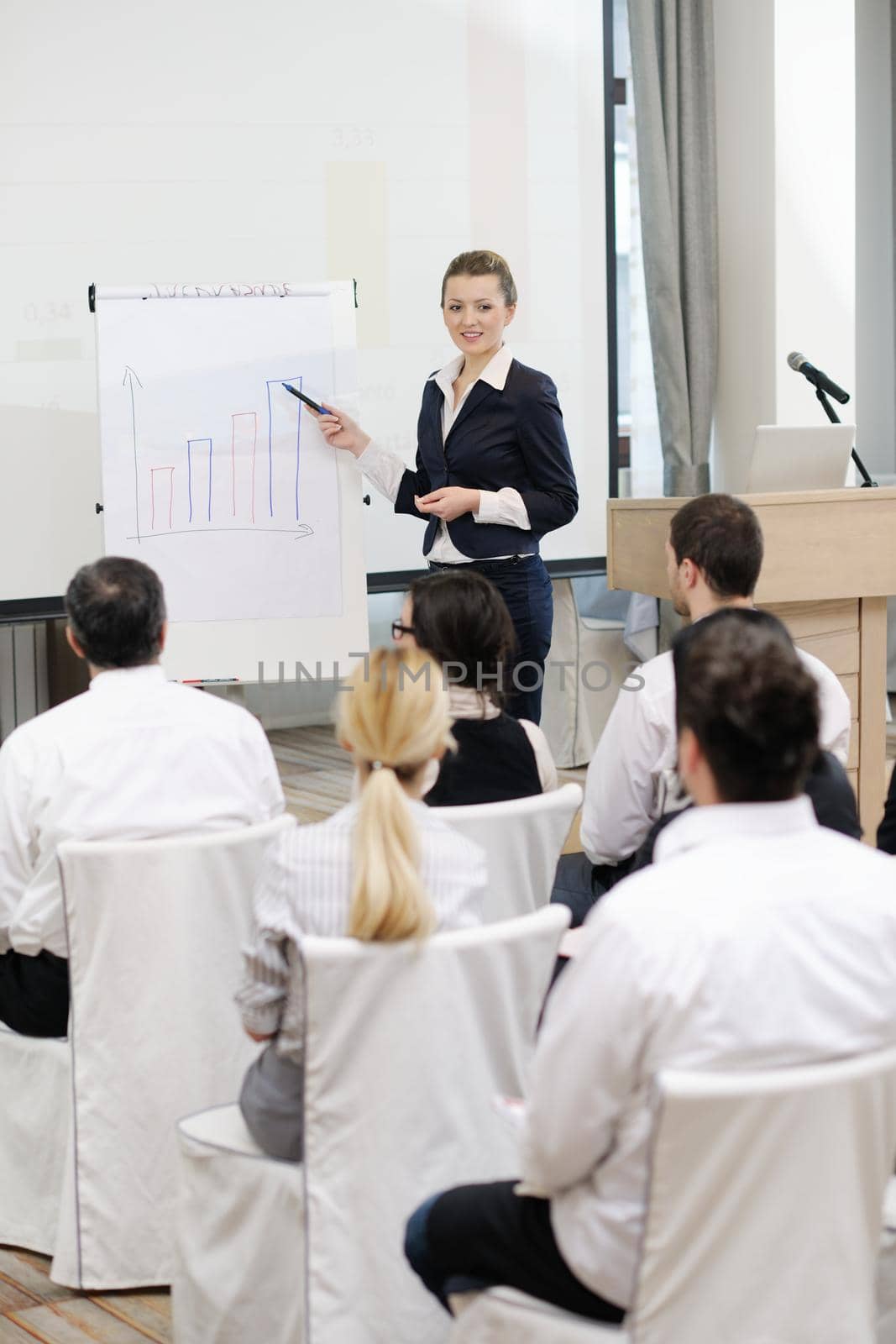 business people group at meeting seminar presentation in brigt conference room