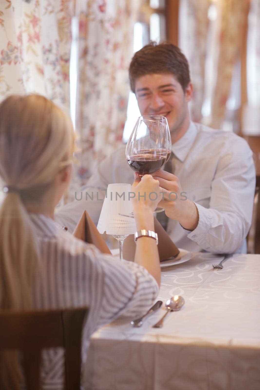 A young couple having dinner at a restaurant