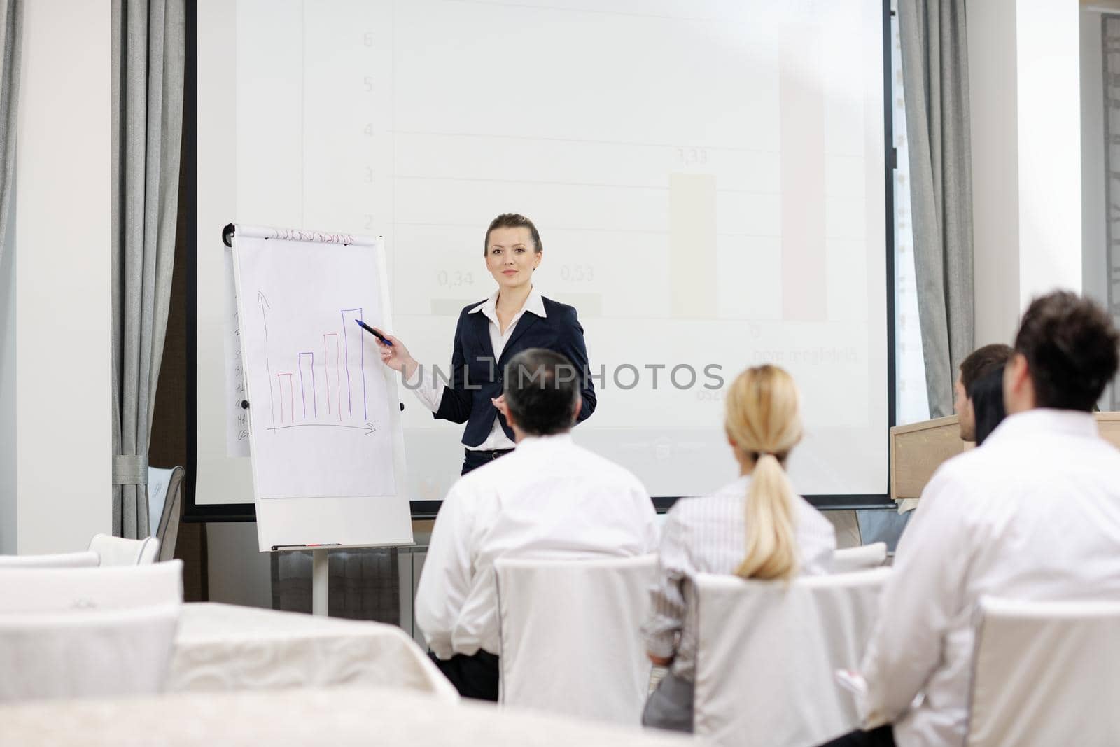 business woman giving presentation by dotshock