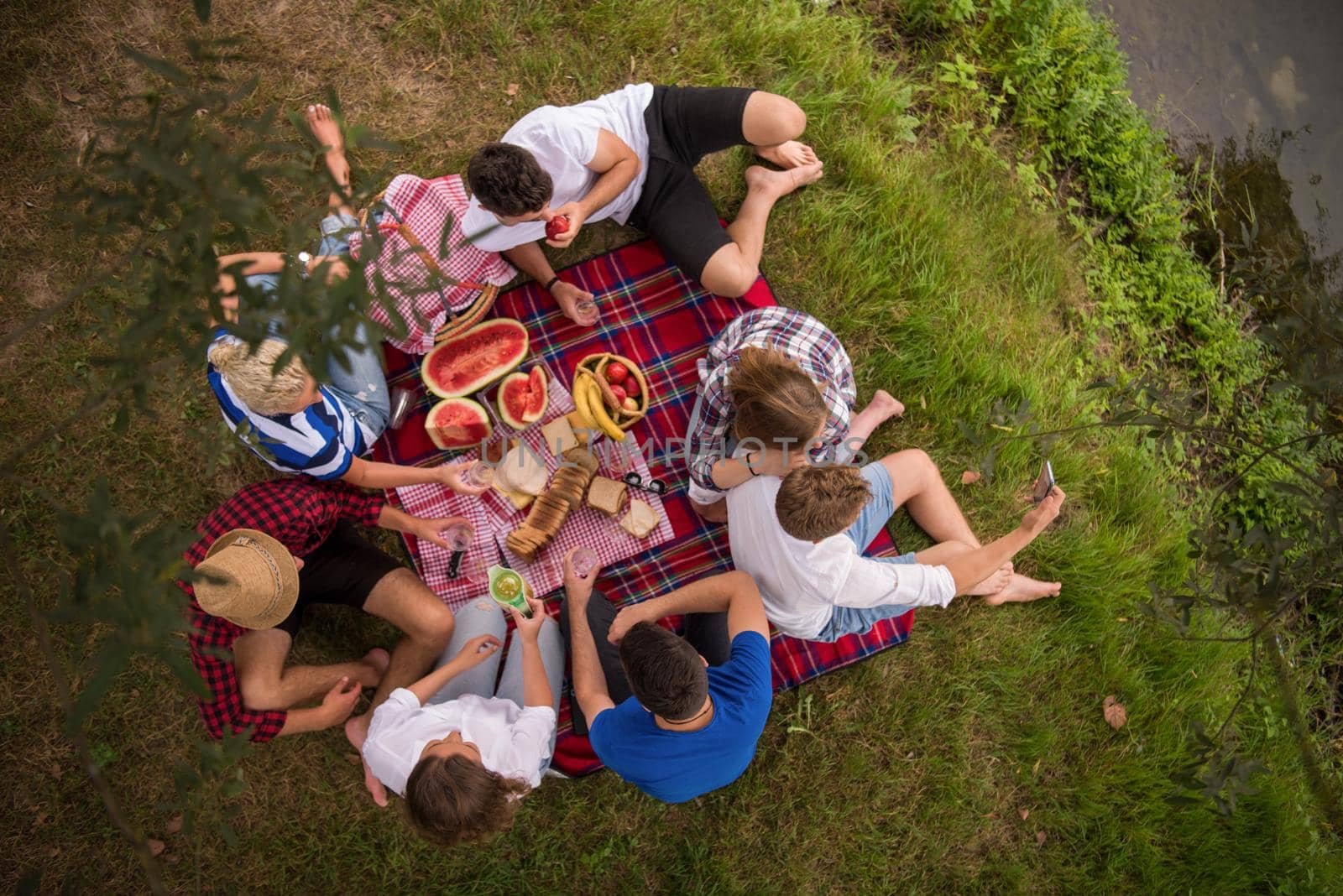 top view of group friends enjoying picnic time by dotshock