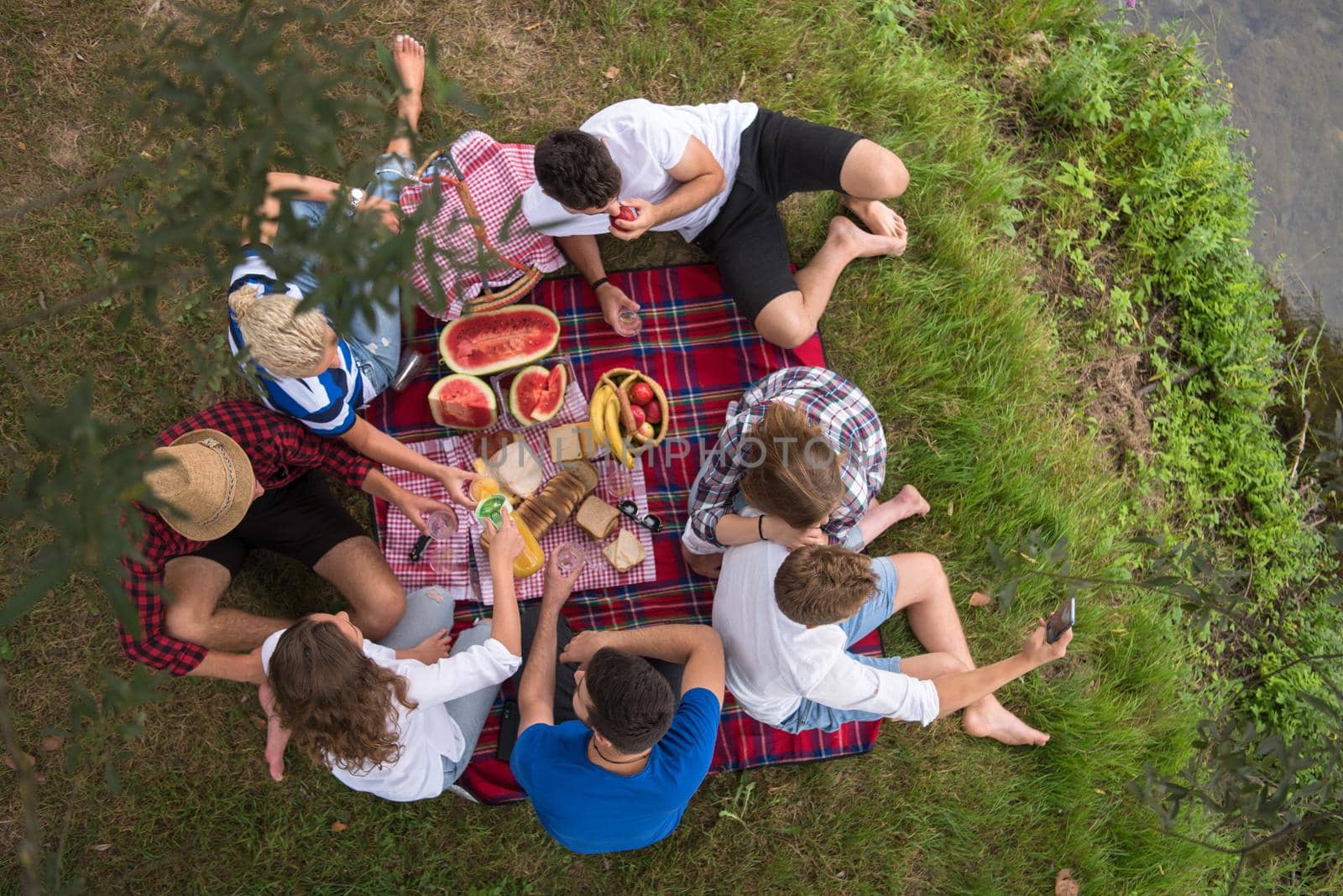 top view of group friends enjoying picnic time by dotshock