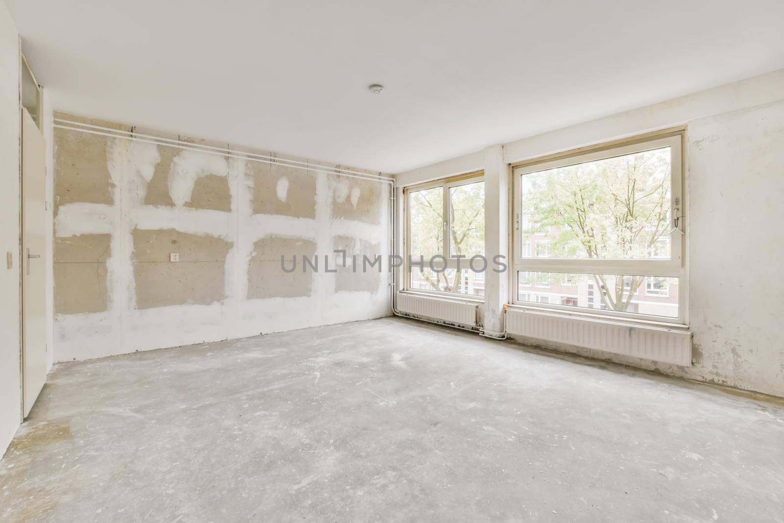 Interior design of a bright room with large windows