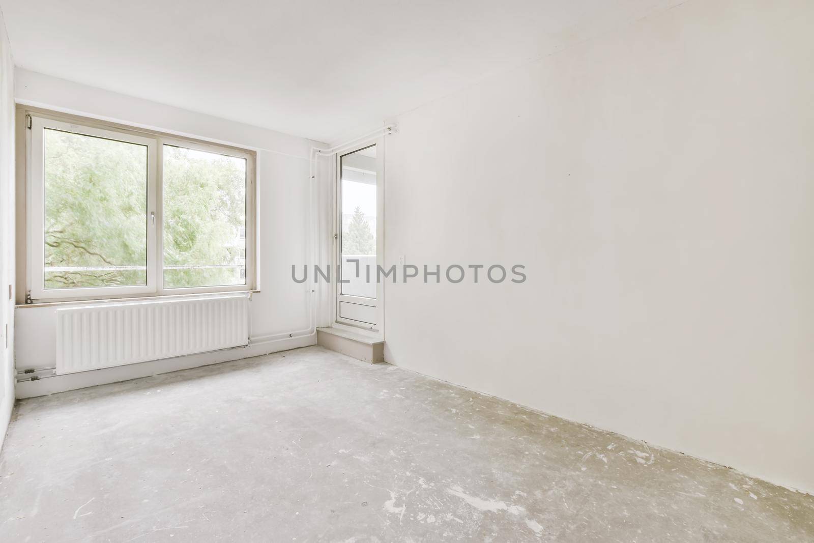 Interior design of a bright room with large windows