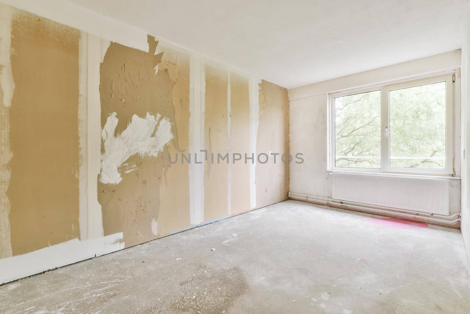 Interior design of a bright room with large windows