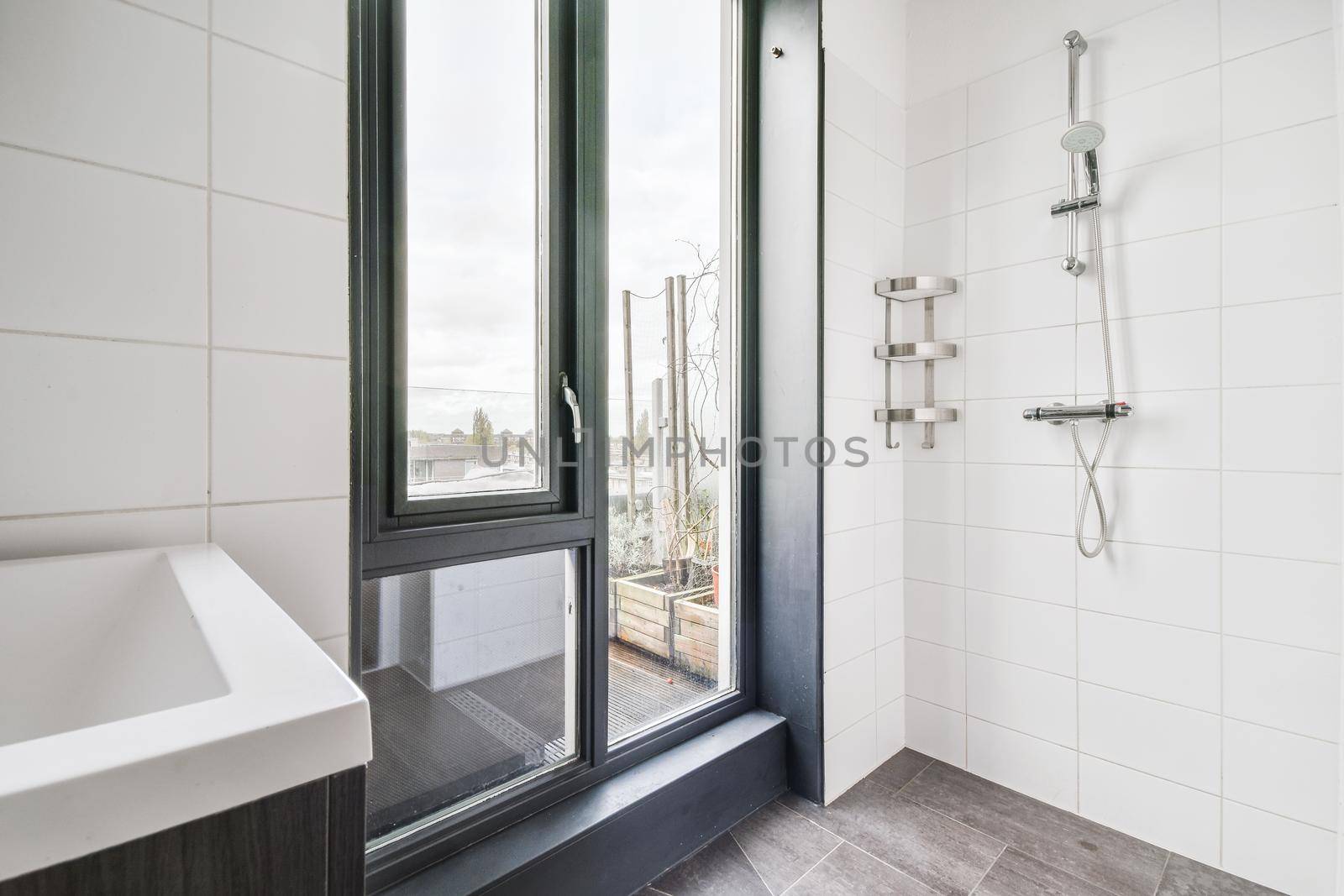 Modern shower stall in a bright bathroom