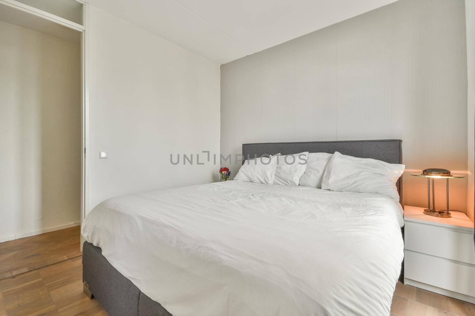Stylish interior of contemporary room with comfortable bed