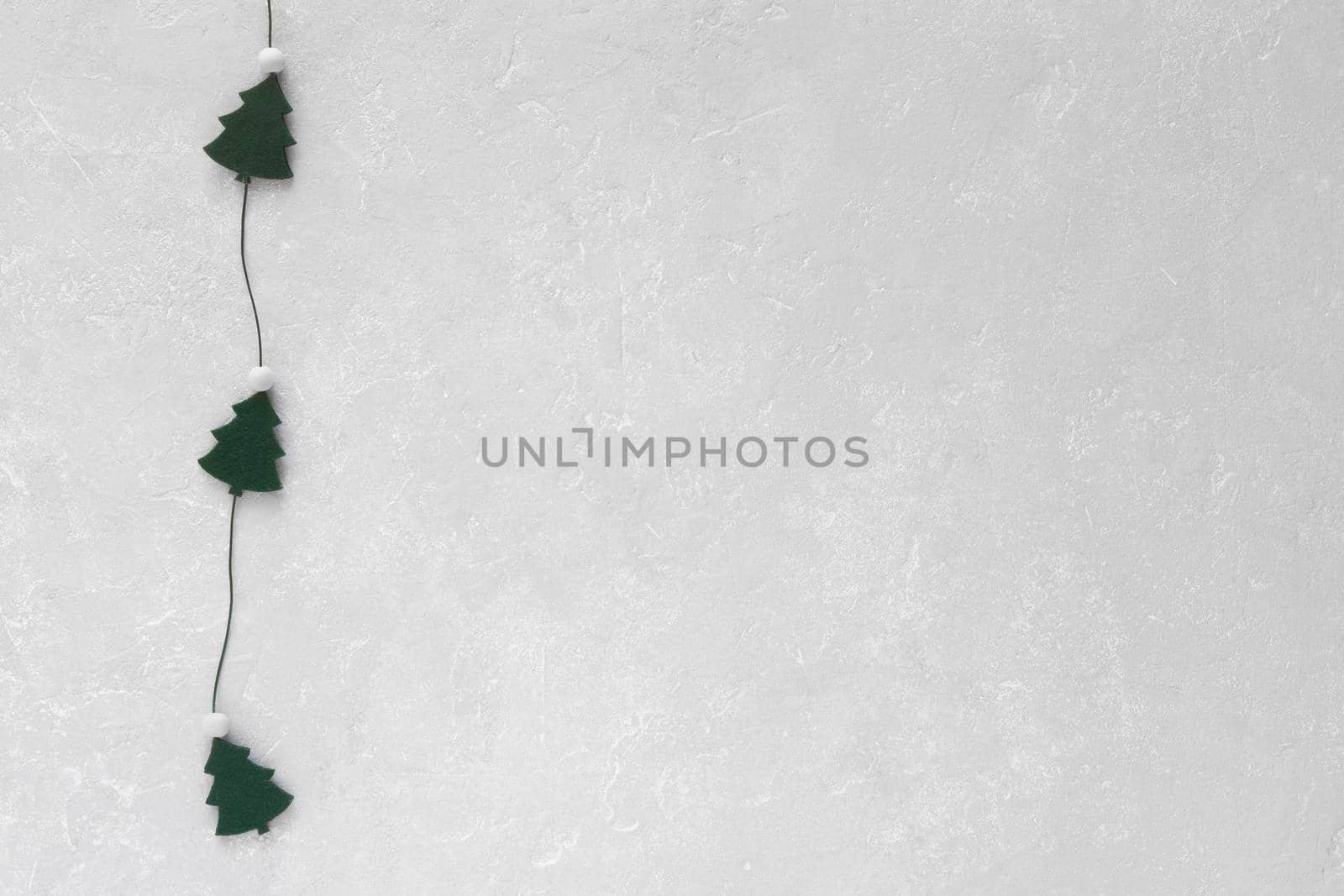 New Year and Christmas trees garland on grey background, copy space