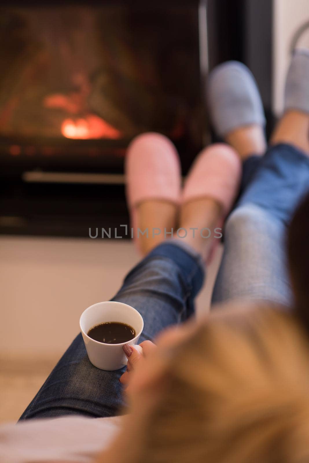 Young couple  in front of fireplace by dotshock