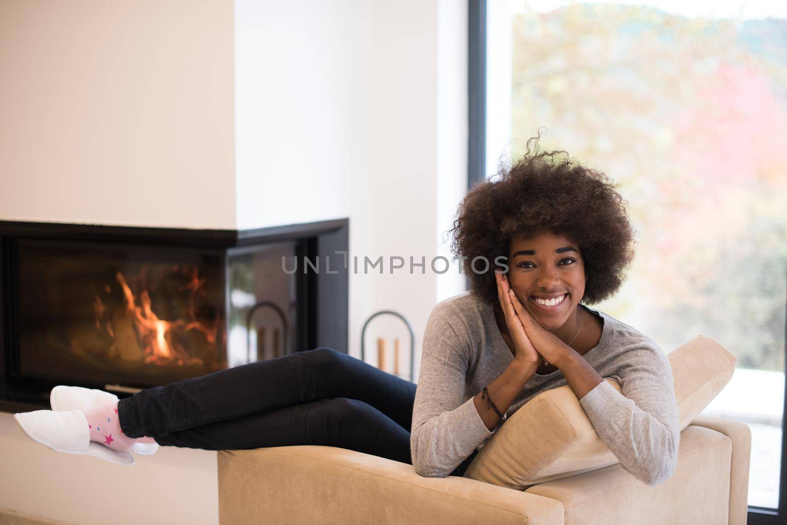 black woman in front of fireplace by dotshock