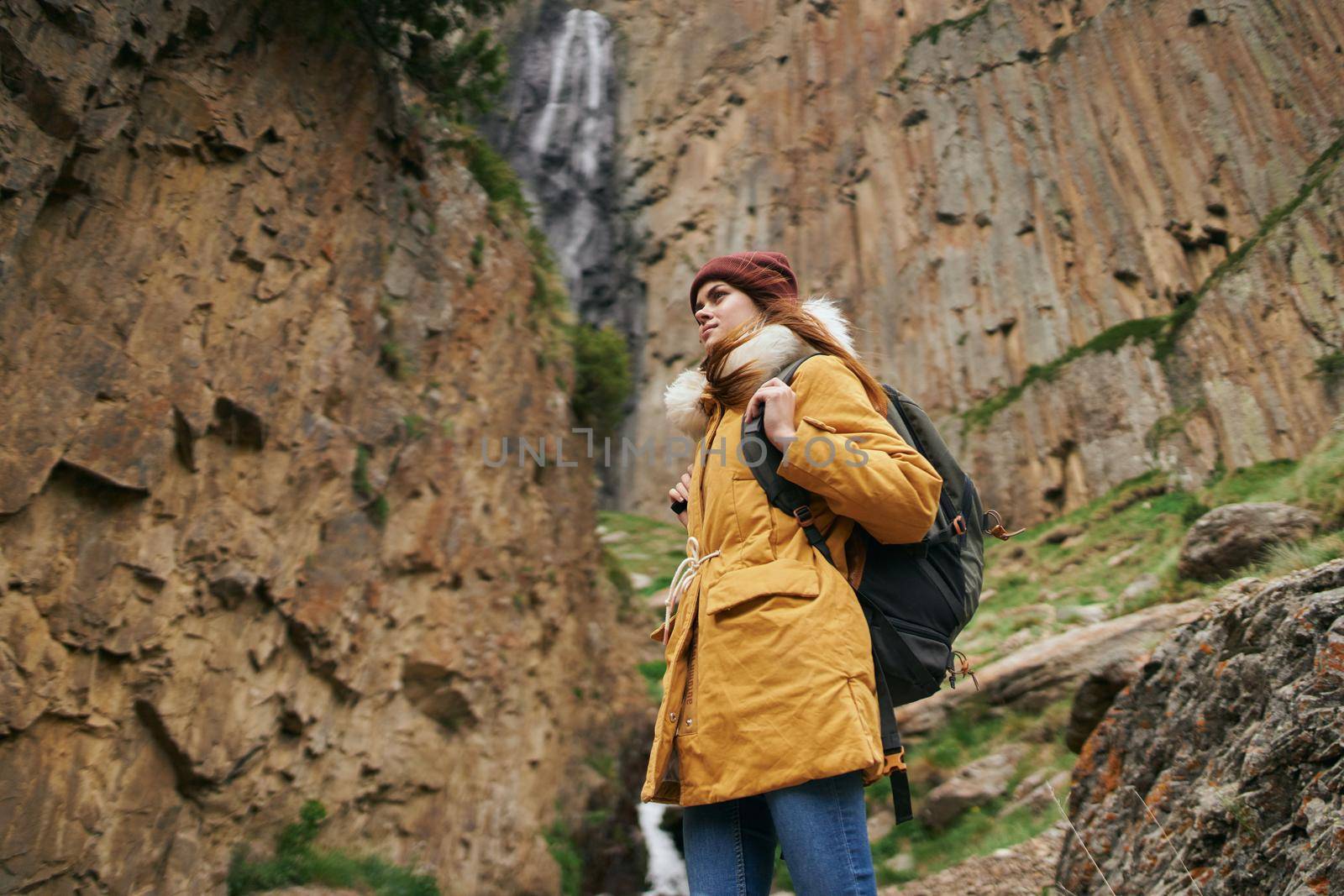 woman hiker with backpack mountains travel adventure freedom. High quality photo