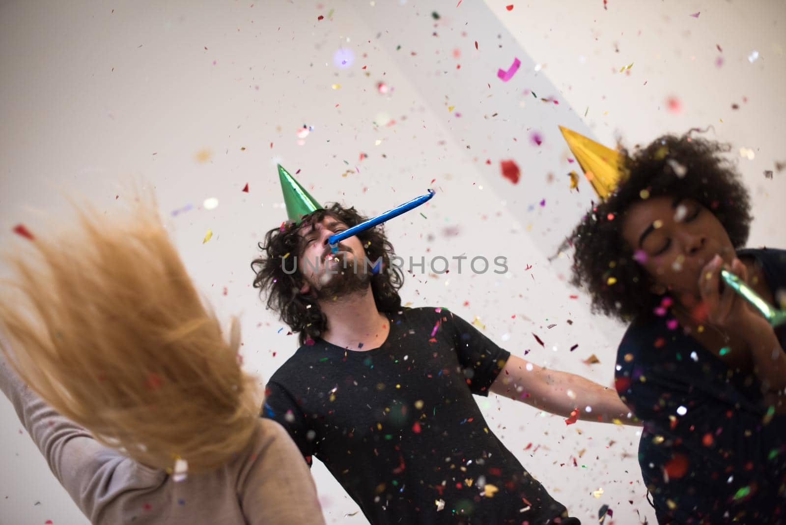 confetti party multiethnic group of people by dotshock